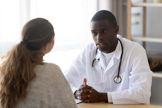 Doctor speaking to patient