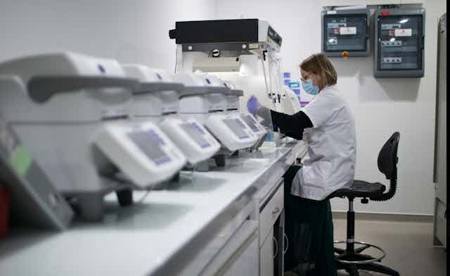 French scientist processing COVID samples