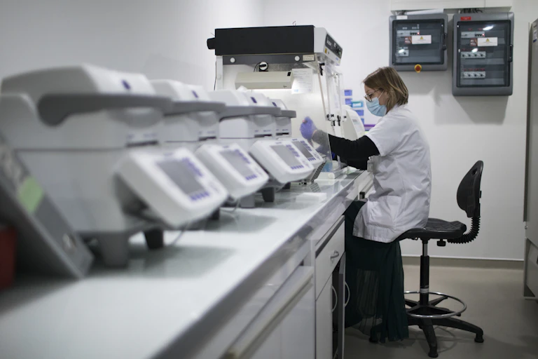 French scientist processing COVID samples