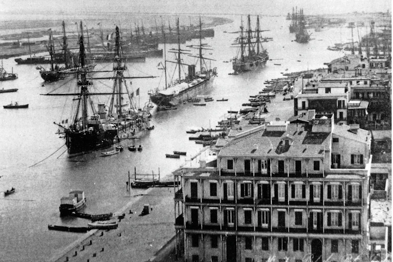 Shipping in the Suez canal at Port Said about 1880. The canal can be seen stretching southwards from this north entrance.