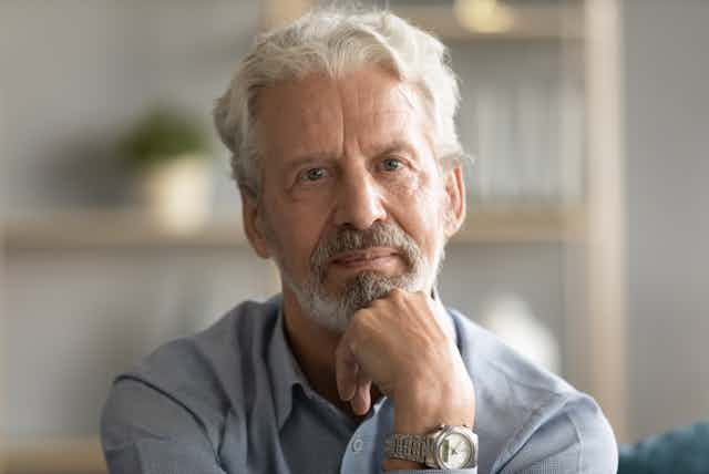 Middle-aged white man looking thoughtful