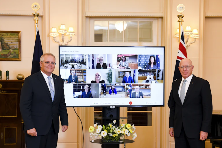 Scott Morrison and Governor-General David Hurley stand in front of a screen, displaying Morrison's newly appointed cabinet