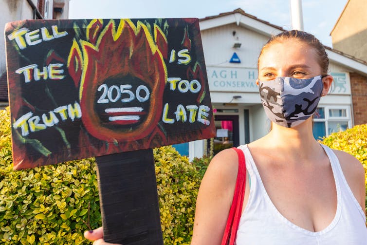 Banner reads 'Tell the truth 2050 is too late'.