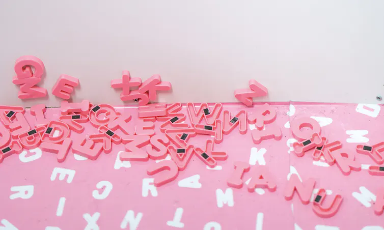 Pink magnet letters on a table