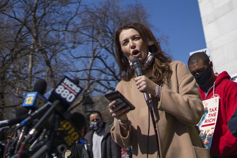 A woman who has accused Cuomo of sexual harassment speaks at a public gathering in New York City.