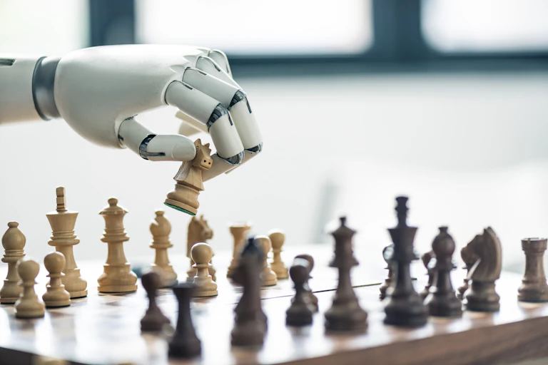 A robot handholds a knight chess piece over a chessboard