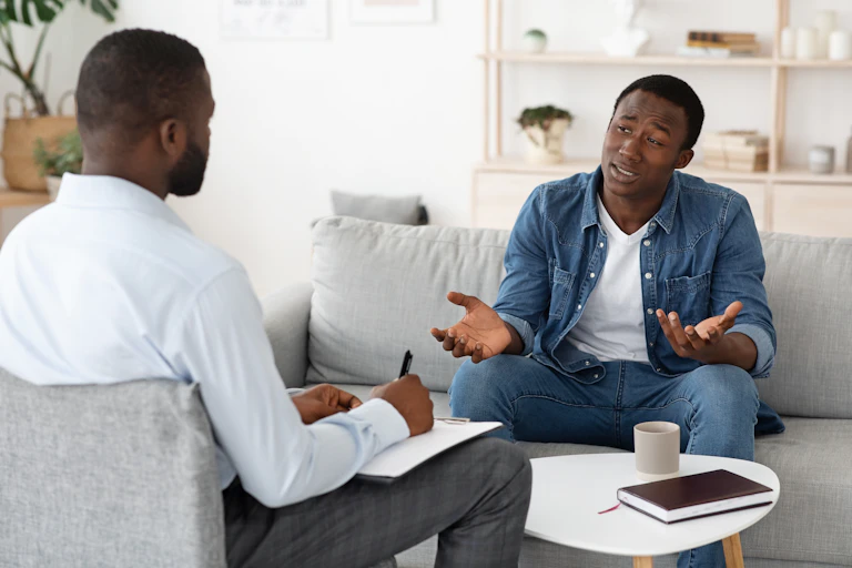 A man talks with his therapist.