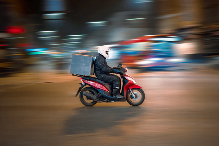 Food delivery man on scooter