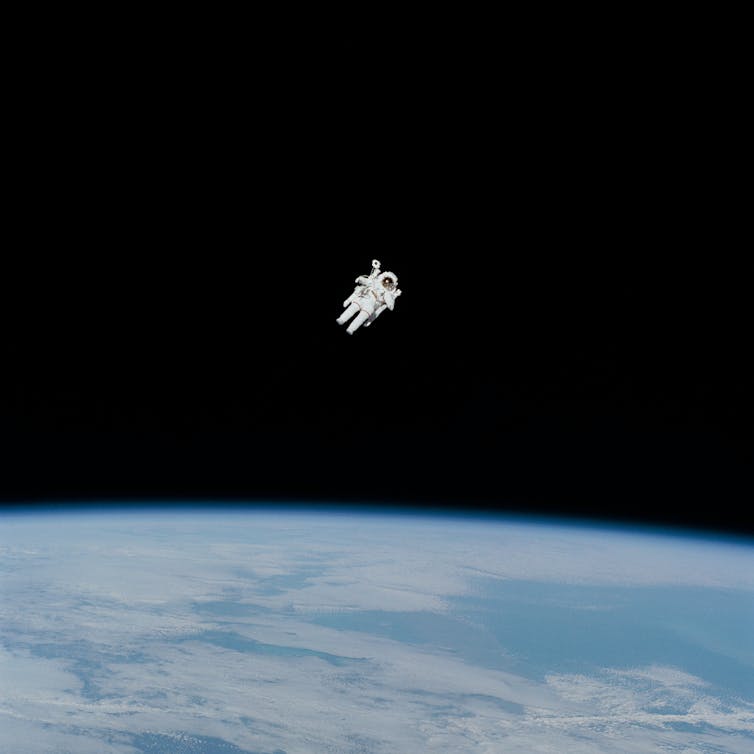 Astronaut in spacesuit floating