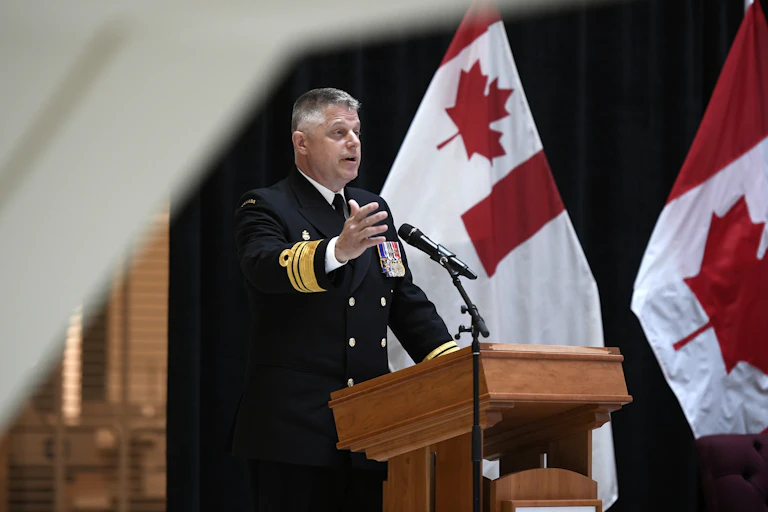 Man stands behind podium