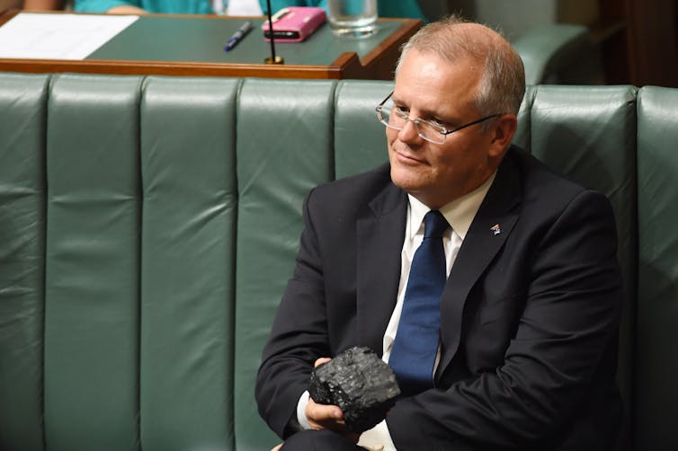 Scott Morrison with a lump of coal to Question Time in 2017.