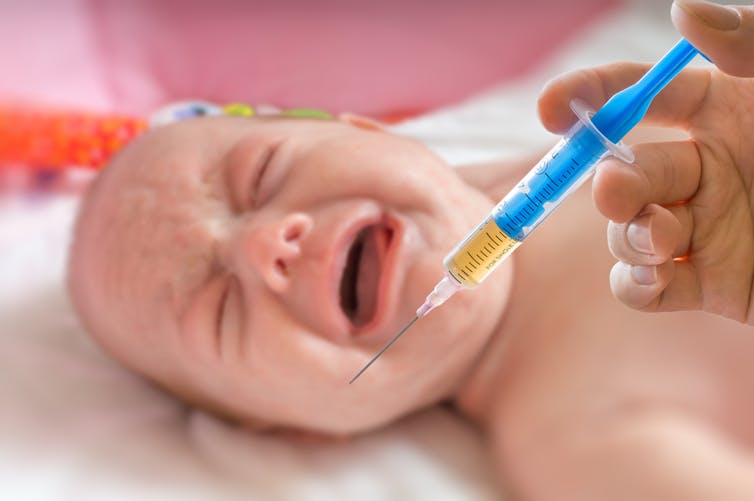 Baby crying with vaccine needle