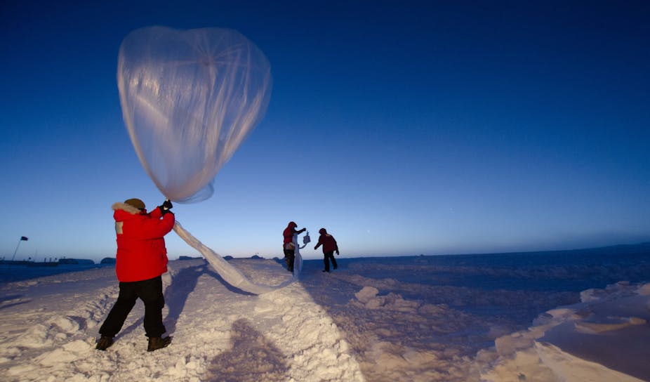 Scientists launch a balloon designed to measure ozone levels.
