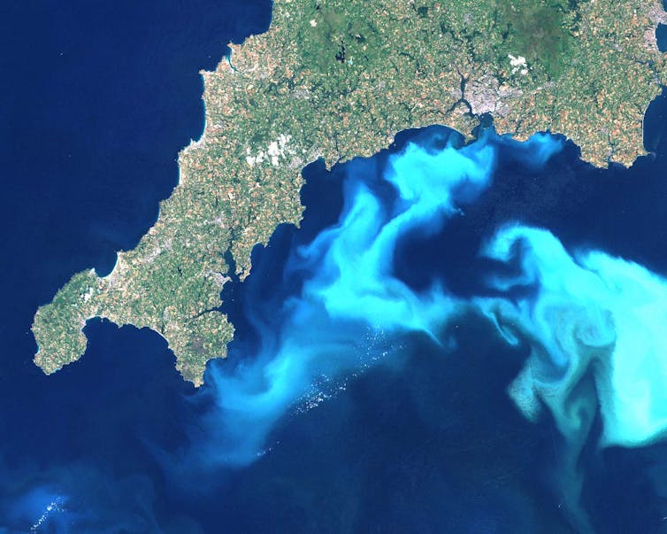 A satellite image depicting a bright blue plume off the south-west coast of England.