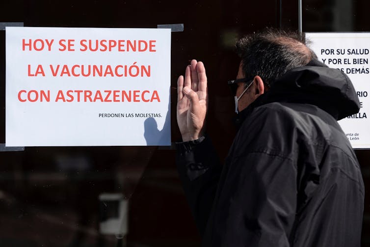 A man outside a closed AstraZeneca vaccination station in Spain.