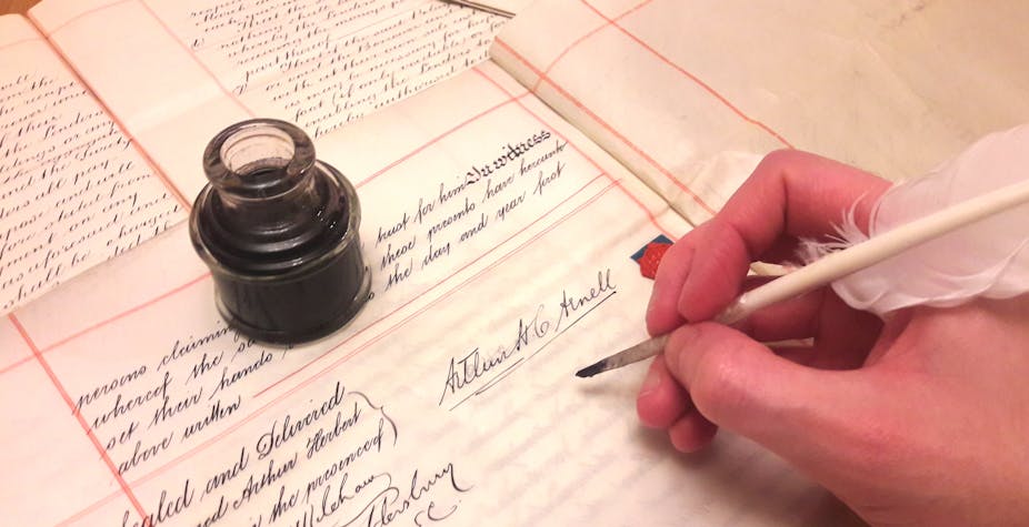 Signing a legal document with ink and quill.