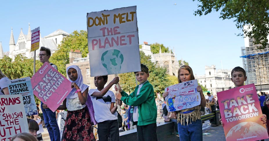 Children hold up posters at the 20th September 2019 climate strike in London