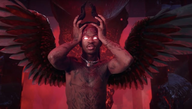 Lil Nas X puts on devil horns in a screenshot from his latest music video.