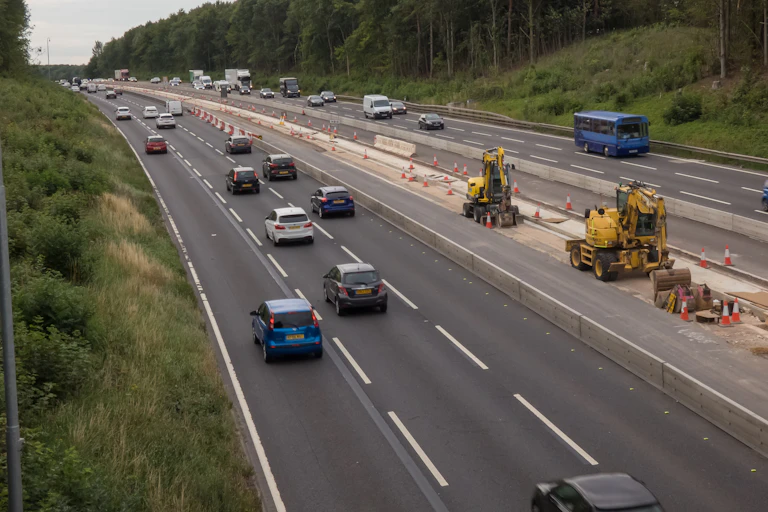 The M1 motorway being extended to accommodate an extra lane.