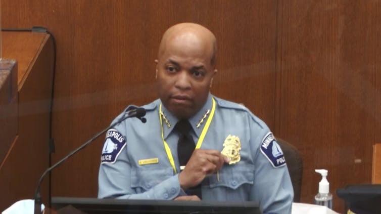 Minneapolis Police Chief Medaria Arradondo in the witness box at the Chauvin trial, fingering his badge.