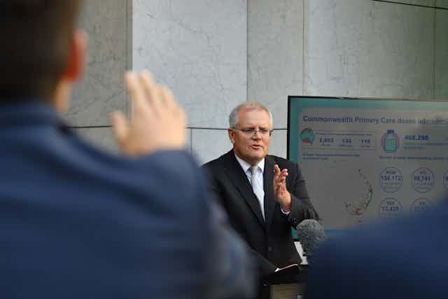 Prime Minister Scott Morrison takes questions from journalists about vaccines.