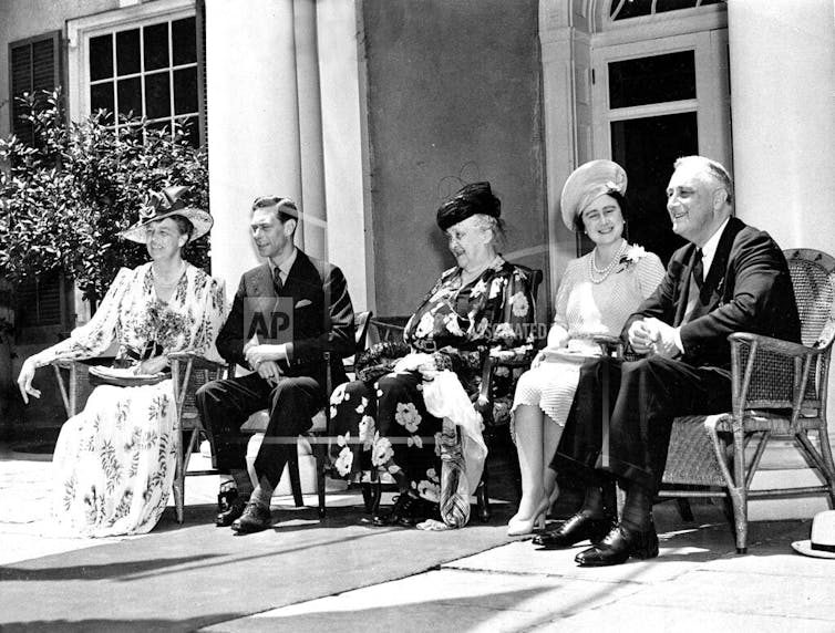 First lady Eleanor Roosevelt; King George VI; Sarah Delano Roosevelt, the president's mother; Queen Elizabeth; and President Franklin D. Roosevelt on the verandah of their family estate in Hyde Park.