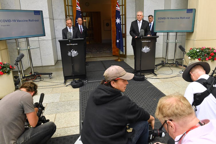 Prime Minister Scott Morrison, Health Minister Greg Hunt and health authorities at a Canberra press conference.
