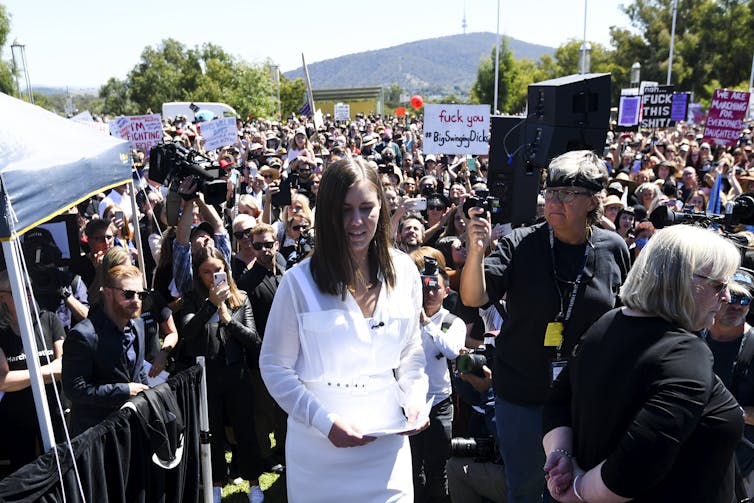 Brittany Higgins walks through the crowd at the women's march in Canberra.