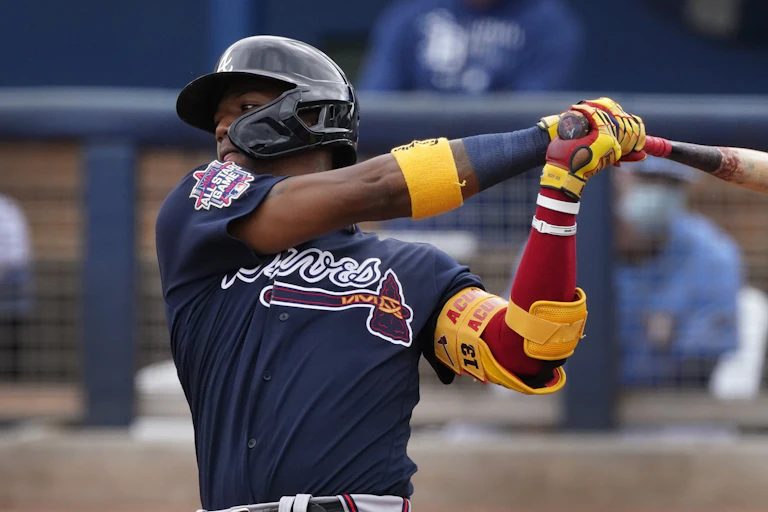 An Atlanta Braves named Ronald Acuna Jr. swings his bat during a spring training baseball game Port Charlotte, Florida.