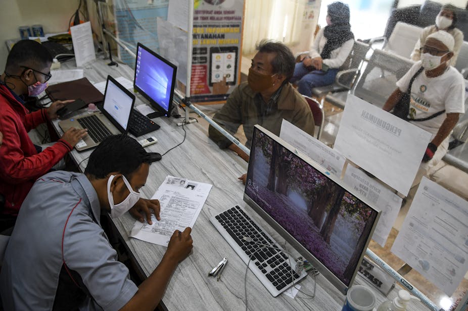 People at a civil registration office in Jakarta.