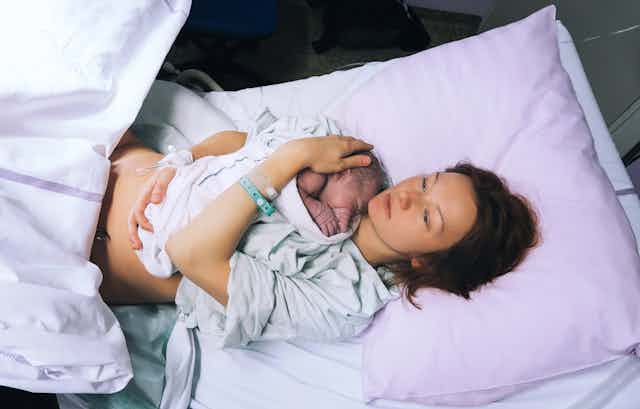 Woman with baby, not long after birth