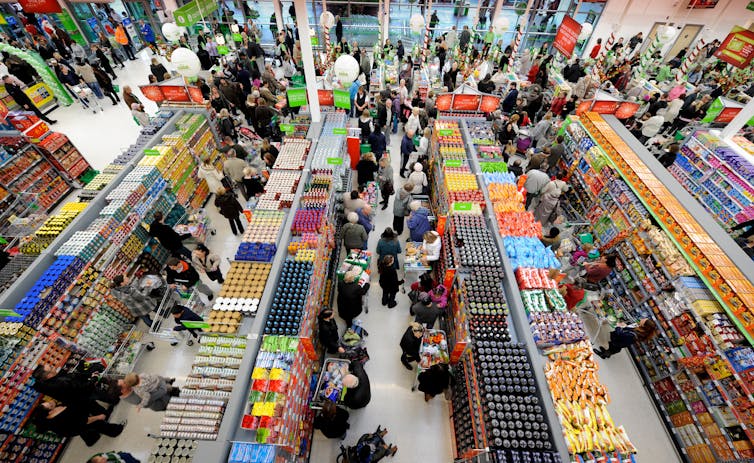 Overhead view of crowded aisles in supermarket