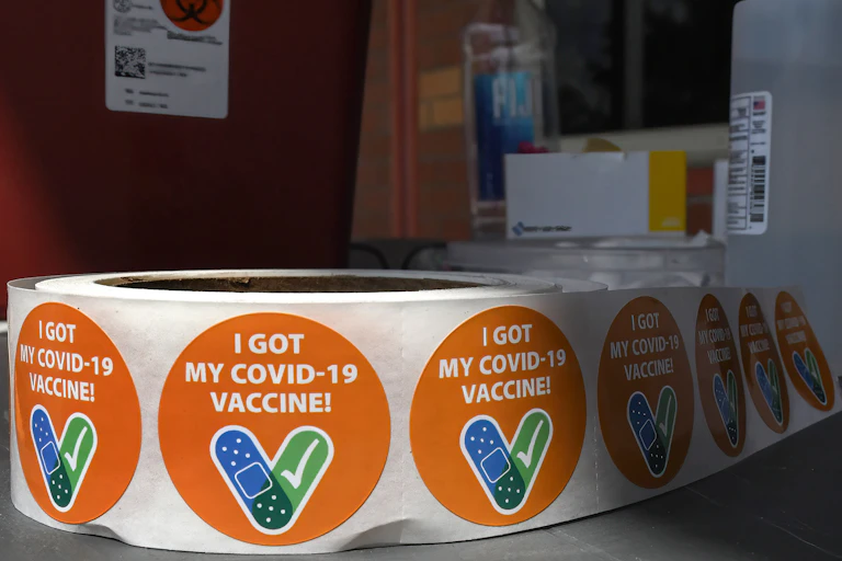 A roll of stickers printed with the words "I got my COVID-19 vaccine"