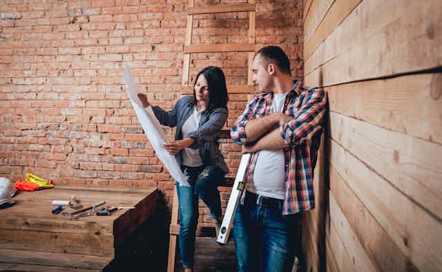 Man and woman looking at home plans