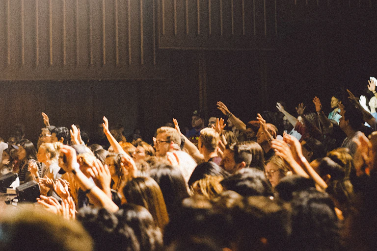 People raise their hands