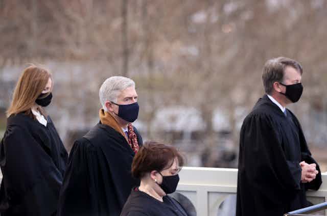 U.S. Supreme Court justices Amy Coney Barrett, Neil Gorsuch, Elena Kagan and Brett Kavanaugh attend President Joe Bidens inauguration.