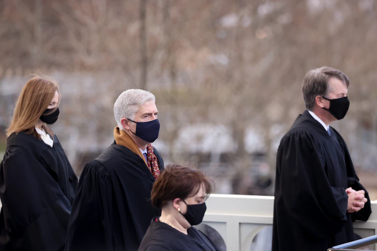 U.S. Supreme Court justices Amy Coney Barrett, Neil Gorsuch, Elena Kagan and Brett Kavanaugh attend President Joe Bidens inauguration.