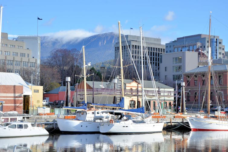 Hobart waterfront with yachts reflected in water
