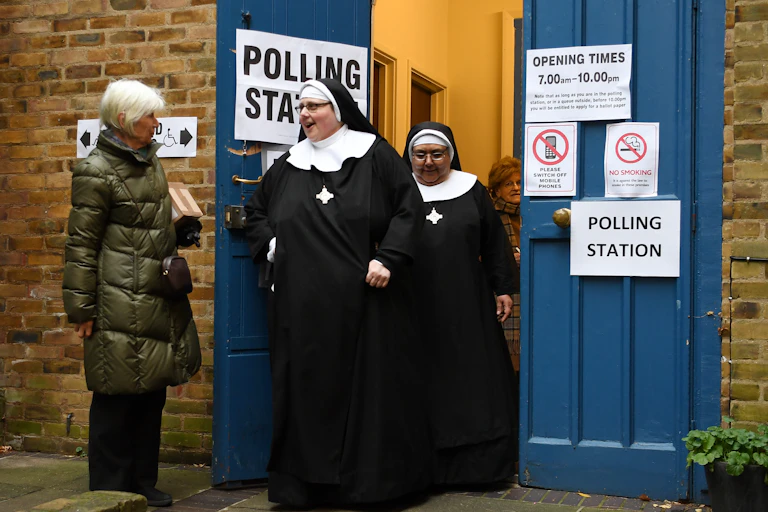 Two nuns leave a polling station after voting in the 2019 general election.