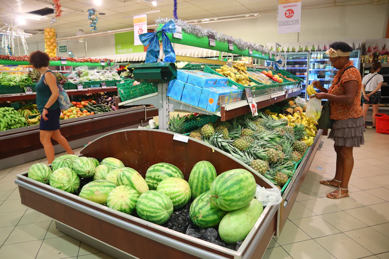 Woman looking at bananas in produce aisle