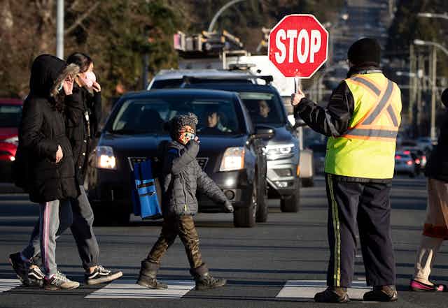 Students cross the street.