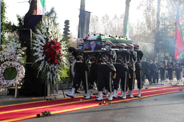Soldiers carrying the coffin of assassinated Iranian nuclear scientist Mohsen Fakhrizadeh at his funeral in Tehran, November 2020.