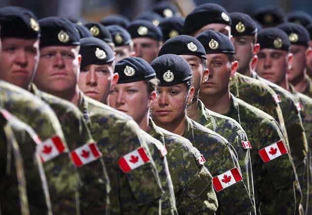 Members of the Canadian Armed Forces march in uniform.
