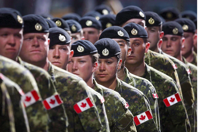 Members of the Canadian Armed Forces march in uniform.