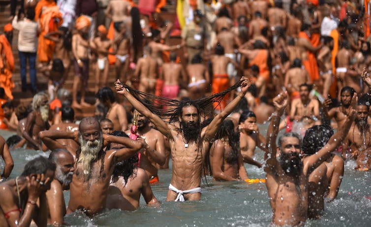 Men bathing in a river.