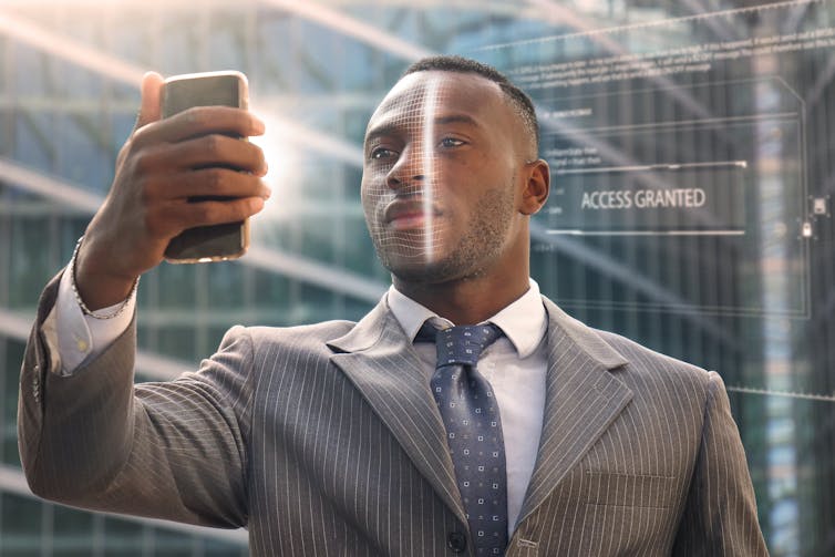 Image of a man looking into a phone.