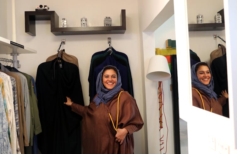 Woman in clothing shop.
