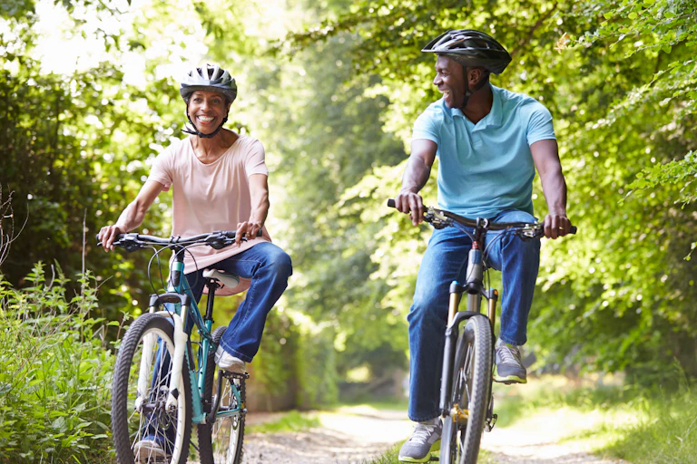 A man and a woman on a bike ride