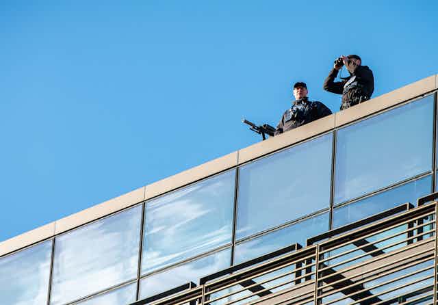 Police snipers on a roof