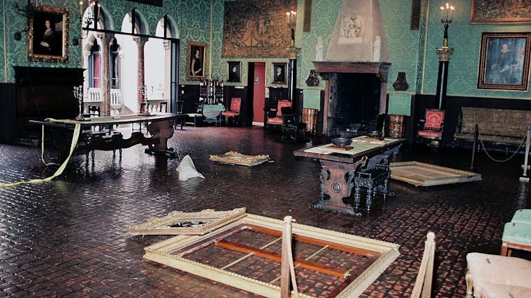 Gallery with damaged frames and artworks